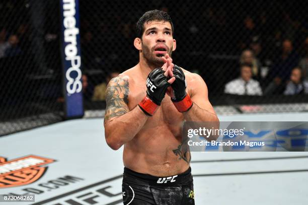 Raphael Assuncao of Brazil celebrates after knocking out Matthew Lopez in their bantamweight bout during the UFC Fight Night event inside the Ted...