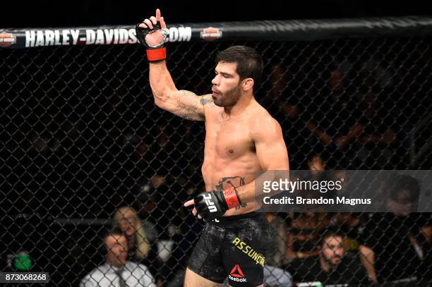 Raphael Assuncao of Brazil celebrates after knocking out Matthew Lopez in their bantamweight bout during the UFC Fight Night event inside the Ted...