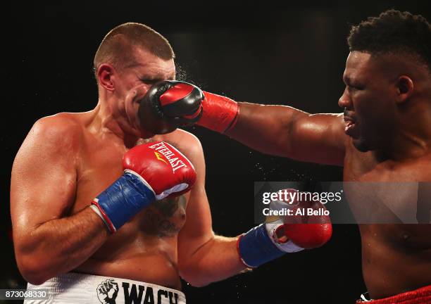 Jarrell Miller punches Mariusz Wach during their Heavyweight bout at Nassau Veterans Memorial Coliseum on November 11, 2017 in Uniondale, New York.