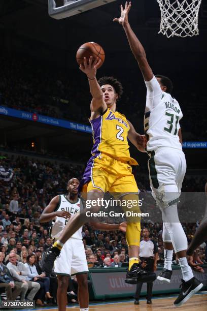 Lonzo Ball of the Los Angeles Lakers becomes the youngest player to record a triple-double during the game against the Milwaukee Bucks on November...