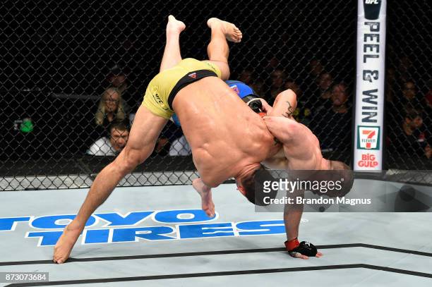 Cezar Ferreira of Brazil takes down Nate Marquardt in their middleweight bout during the UFC Fight Night event inside the Ted Constant Convention...