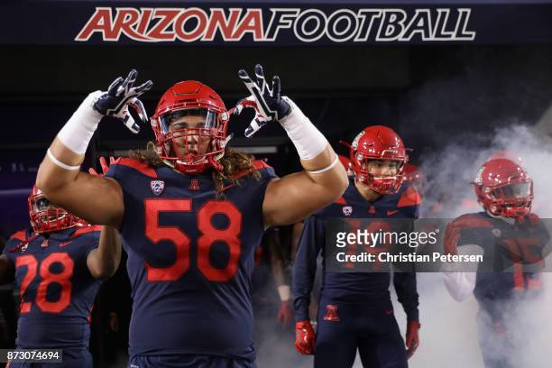 Offensive lineman Layth Friekh of the Arizona Wildcats prepares to take the field with teammates before the college football game against the Oregon...