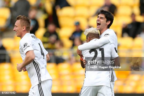 Gui Finkler of the Phoenix celebrates with Roy Krishna and Goran Paracki after scoring a goal during the round six A-League match between the...