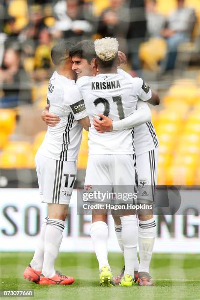 Gui Finkler of the Phoenix celebrates with Roy Krishna and Ali Abbas after scoring a goal during the round six A-League match between the Wellington...