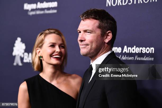 Lara Bingle and Sam Worthington attend The 2017 Baby2Baby Gala presented by Paul Mitchell on November 11, 2017 in Los Angeles, California.