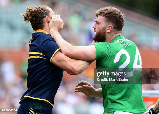 Nat Fyfe of Australia and Aidan O'Shea of Ireland come to blows during game one of the International Rules Series between Australia and Ireland at...