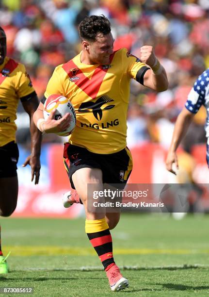 Lachlan Lam of Papua New Guinea celebrates as he goes on to score a try during the 2017 Rugby League World Cup match between Papua New Guinea and the...