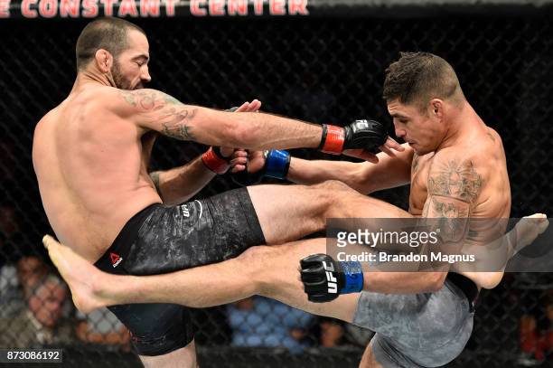 Matt Brown and Diego Sanchez exchange kicks in their welterweight bout during the UFC Fight Night event inside the Ted Constant Convention Center on...