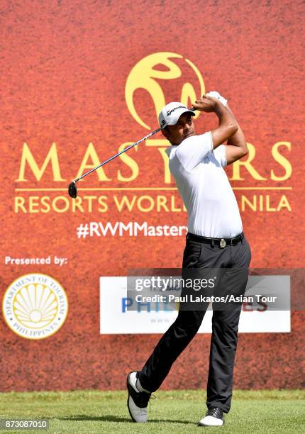 Jyoti Randahawa of India plays a shot during round four of the Resorts World Manila Masters at Manila Southwoods Golf and Country Club on November...