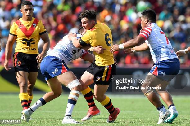 Lachlan Lam of Papua New Guinea attempts to break through the defence during the 2017 Rugby League World Cup match between Papua New Guinea and the...