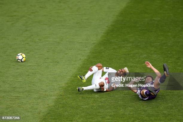 Roy Krishna of the Phoenix and Alex Grant of the Glory react after colliding during the round six A-League match between the Wellington Phoenix and...
