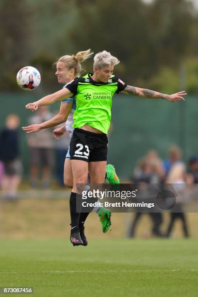 Michelle Heyman of Canberra and Georgia Yeoman-Dale of Sydney contest a high ball during the round three W-League match between Canberra United and...