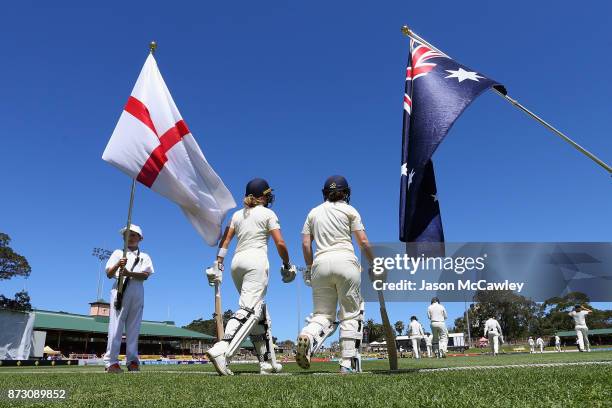 Lauren Winfield and Tammy Beaumont of England take to the field during day four of the Women's Test match between Australia and England at North...