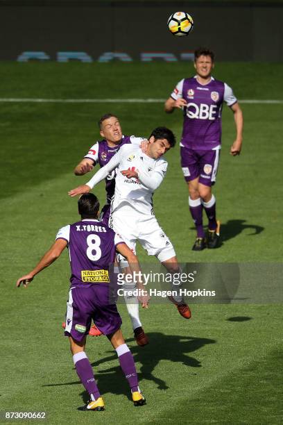 Gui Finkler of the Phoenix and Shane Lowry of the Glory compete for a header during the round six A-League match between the Wellington Phoenix and...