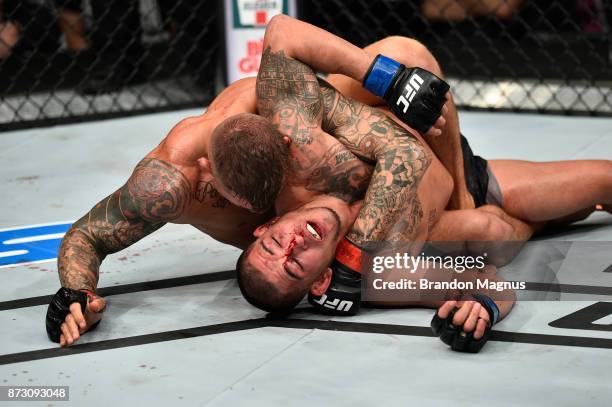 Dustin Poirier attempts to submit Anthony Pettis in their lightweight bout during the UFC Fight Night event inside the Ted Constant Convention Center...