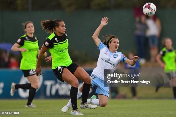 Toni Pressley of Canberra gives a penatly away against Lisa De Vanna of Sydney during the round three W-League match between Canberra United and...