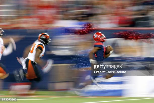 Quarterback Khalil Tate of the Arizona Wildcats runs for a 71-yard touchdown during the third quarter half of the college football game against the...