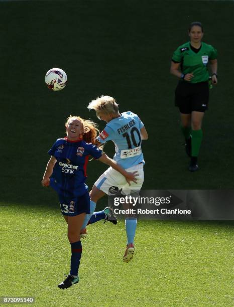 Tori Huster of the Jets and Jess Fishlock of Melbourne City compete for the ball during the round three W-League match between Melbourne City and the...