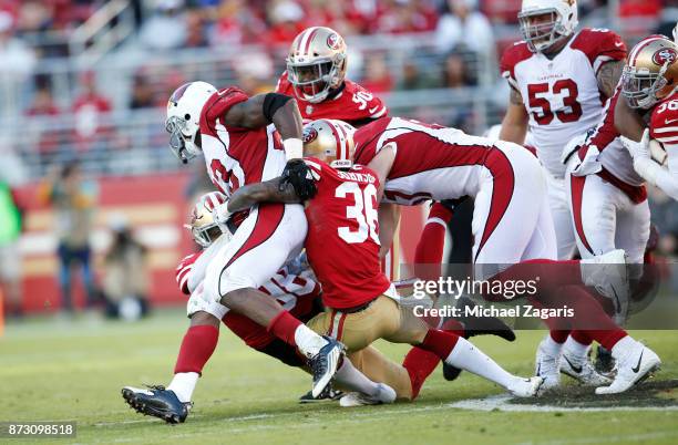 Dontae Johnson of the San Francisco 49ers tackles Adrian Peterson of the Arizona Cardinals during the game at Levi's Stadium on November 5, 2017 in...