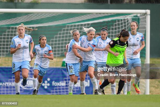 Kylie Ledbrook of Sydney celebrates scoring a goal with team mates during the round three W-League match between Canberra United and Sydney FC at...