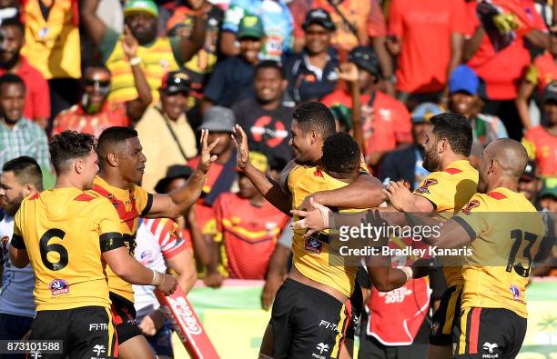 Papua New Guinean players celebrate a try by Justin Olam during the 2017 Rugby League World Cup match between Papua New Guinea and the United States...