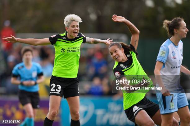 Michelle Heyman of Canberra celebrates as Toni Pressley of Canberra scores a goal during the round three W-League match between Canberra United and...