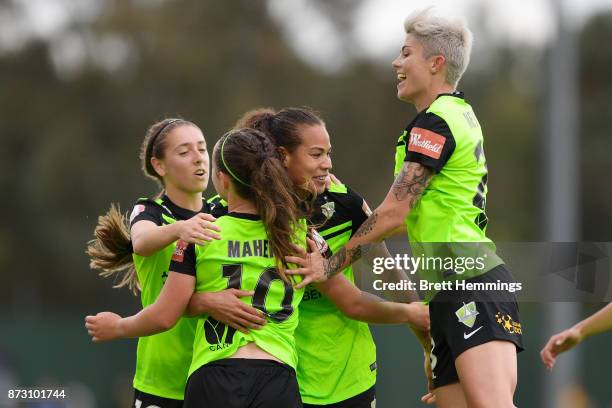 Toni Pressley of Canberra celebrates scoring a goal with team mates during the round three W-League match between Canberra United and Sydney FC at...