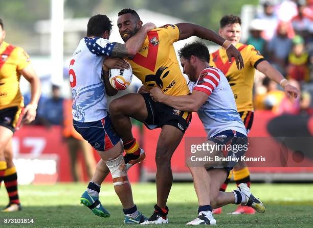 Moses Meninga of Papua New Guinea takes on the defence during the 2017 Rugby League World Cup match between Papua New Guinea and the United States on...