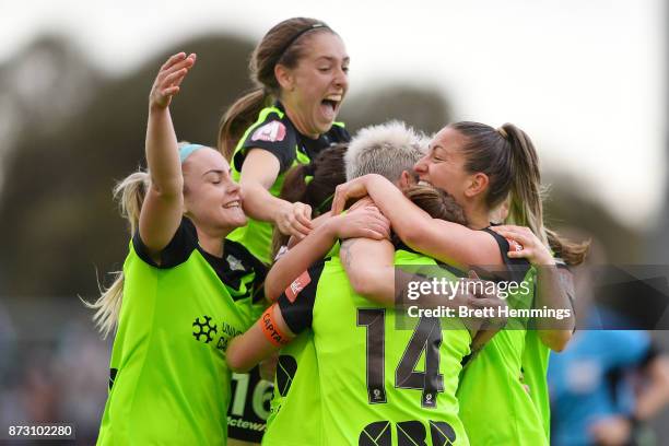 Michelle Heyman of Canberra celebrates scoring a goal with team mates during the round three W-League match between Canberra United and Sydney FC at...