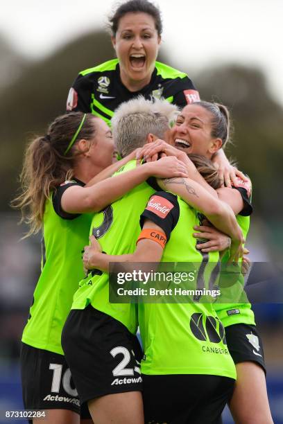 Michelle Heyman of Canberra celebrates scoring a goal with team mates during the round three W-League match between Canberra United and Sydney FC at...
