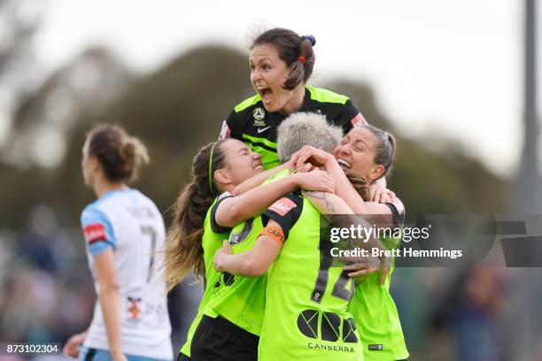 Michelle Heyman of Canberra celebrates scoring a goal with team mates during the round three W-League match between Canberra United and Sydney FC at...