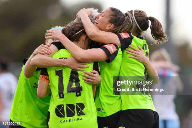 Michelle Heyman of Canberra celebrates scoring a goal with team mates during the round three W-League match between Canberra United and Sydney FC at...