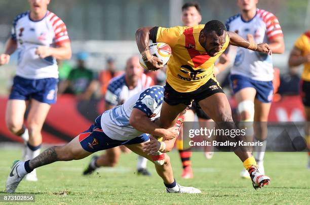 Stargroth Amean of Papua New Guinea breaks through the defence during the 2017 Rugby League World Cup match between Papua New Guinea and the United...