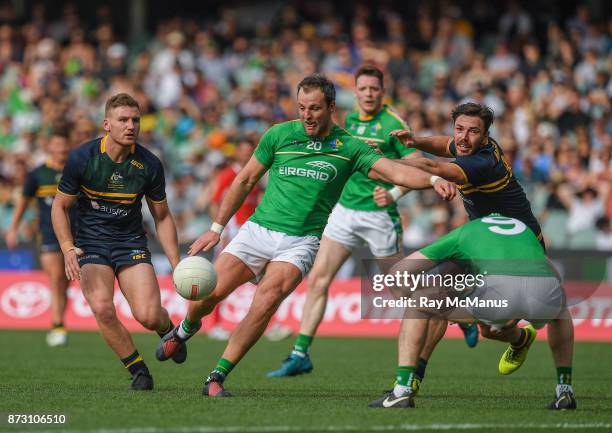 Adelaide , Australia - 12 November 2017; Paul Geaney of Ireland ducks as his team mate Michael Murphy fires in a shot under pressure from Michael...