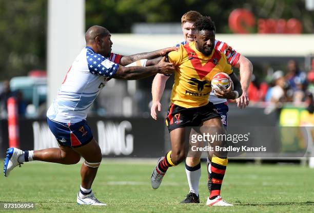 James Segeyaro of Papua New Guinea breaks away from the defence during the 2017 Rugby League World Cup match between Papua New Guinea and the United...