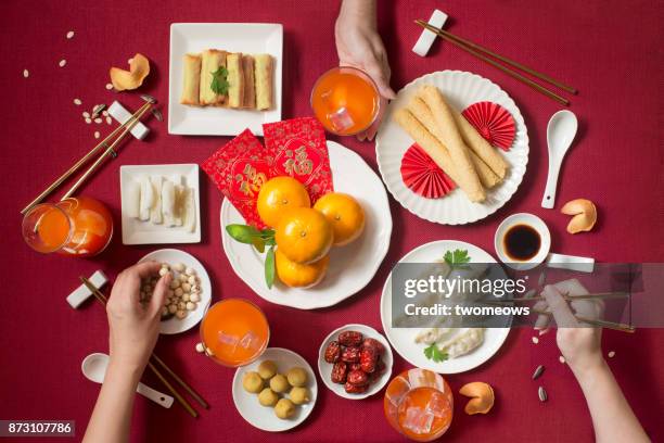 flat lay chinese new year food and drink still life. - chinese new year food stock pictures, royalty-free photos & images