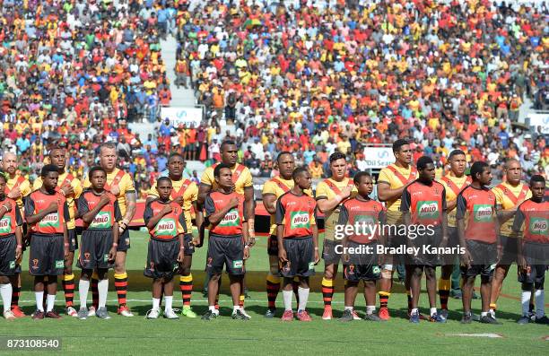 David Mead of Papua New Guinea and team mates during their national anthem before the 2017 Rugby League World Cup match between Papua New Guinea and...