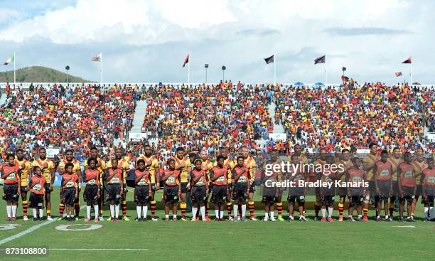 David Mead of Papua New Guinea and team mates during their national anthem before the 2017 Rugby League World Cup match between Papua New Guinea and...