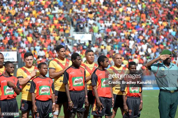 David Mead of Papua New Guinea and team mates during their national anthem before the 2017 Rugby League World Cup match between Papua New Guinea and...