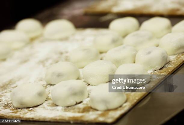 rice dumpling has sweet bean paste in it - daifuku mochi stockfoto's en -beelden