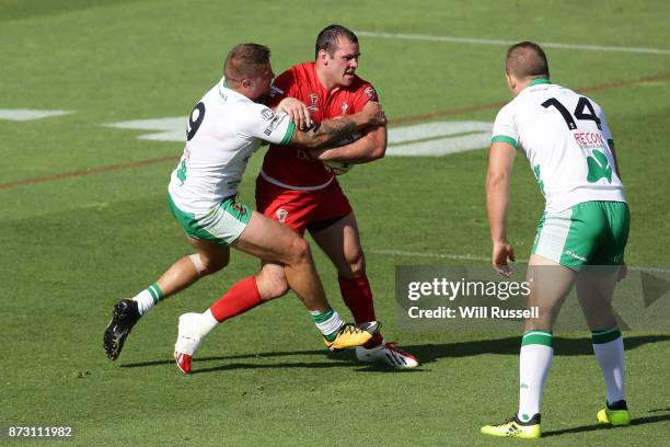 Steve Parry of Wales is tackled by Michael Mcilorum of Ireland during the 2017 Rugby League World Cup match between Wales and Ireland at nib Stadium...