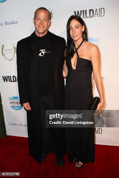 Jeb Corliss and guest arrive at the Evening with WildAid at the Beverly Wilshire Four Seasons Hotel on November 11, 2017 in Beverly Hills, California.