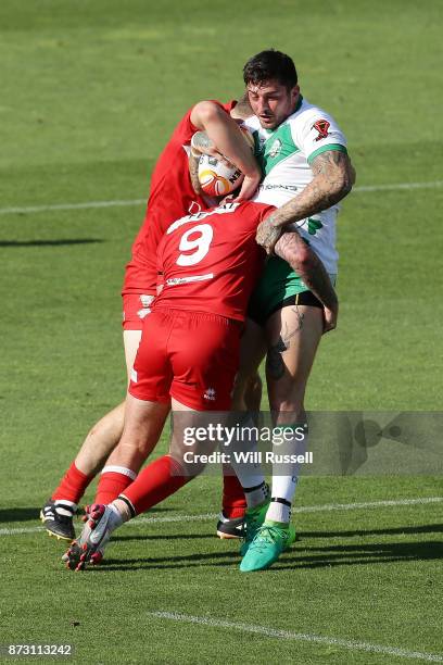 Oliver Roberts of Ireland is tackled by Matty Fozard of Wales during the 2017 Rugby League World Cup match between Wales and Ireland at nib Stadium...