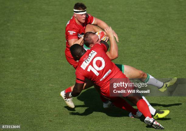 George King of Ireland is tackled by Philip Joseph of Wales during the 2017 Rugby League World Cup match between Wales and Ireland at nib Stadium on...