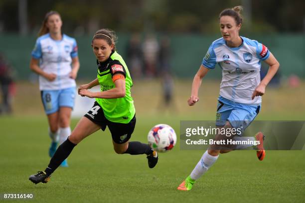 Ashleigh Sykes of Canberra and Rachel Soutar of Sydney contest the ball during the round three W-League match between Canberra United and Sydney FC...
