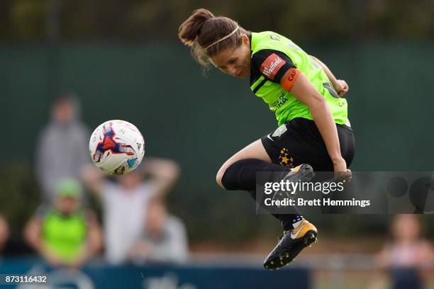 Ashleigh Sykes of Canberra heads a high ball during the round three W-League match between Canberra United and Sydney FC at McKellar Park on November...