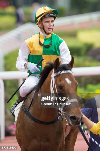 Jockey Sam Clipperton riding Sparkling Dragon wins Race 5 Panasonic 4k Oled TV Handicap at Sha Tin racecourse on November 11, 2017 in Hong Kong, Hong...