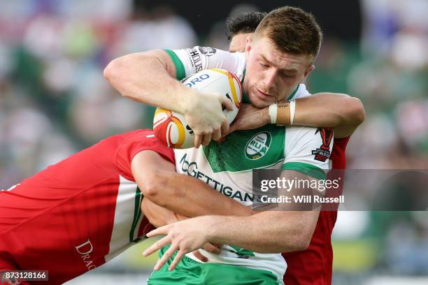 Ed Chamberlain of Ireland is tackled during the 2017 Rugby League World Cup match between Wales and Ireland at nib Stadium on November 12, 2017 in...