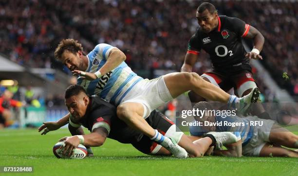 Nathan Hughes of England dives over for their first try during the Old Mutual Wealth Series international match between England and Argentina at...