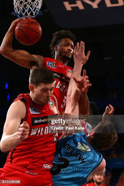 Jean-Pierre Tokoto of the Wildcats pulls down a rebound during the round six NBL match between the Perth Wildcats and the New Zealand Breakers at...